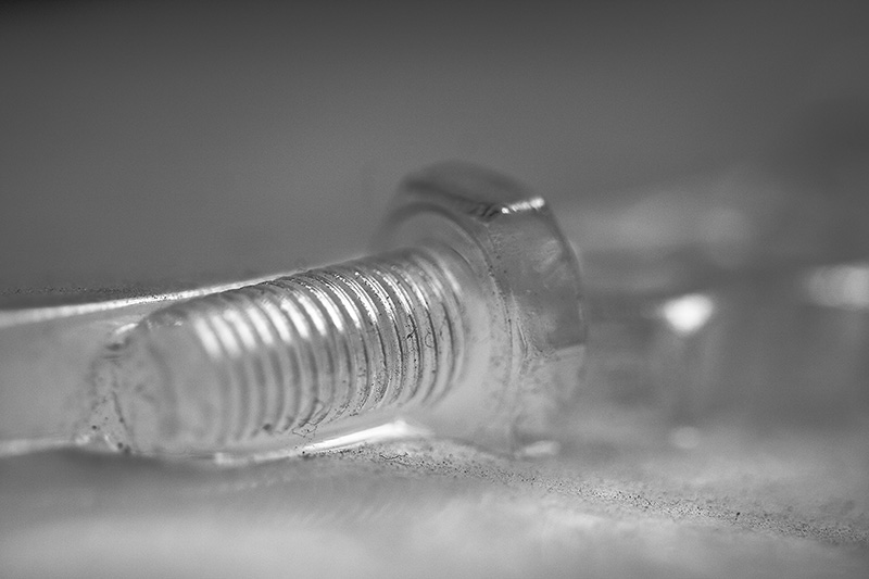 A clear, vacuum-formed plastic bolt.