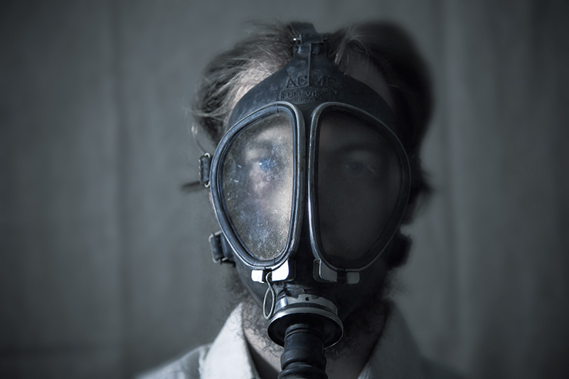 A self-portrait while wearing a gas mask.