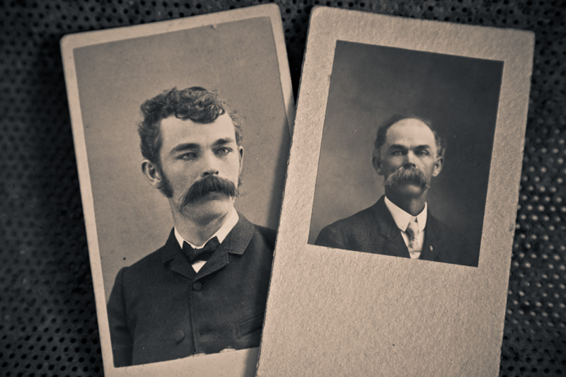 A pair of photographs of a man with a giant mustache, one when he is young, the other when he is old.