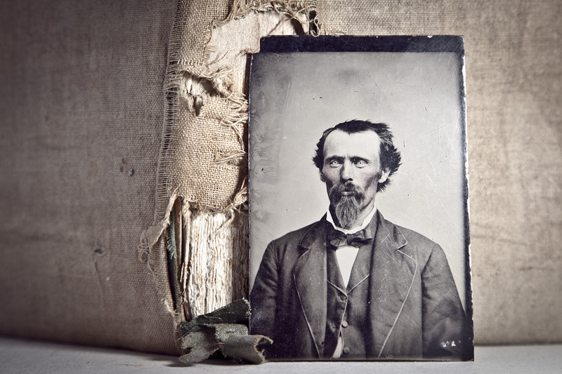 A tintype portrait of a man with crazy eyes.