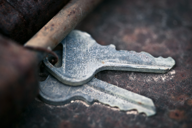 Corroding keys atop rusting metal.