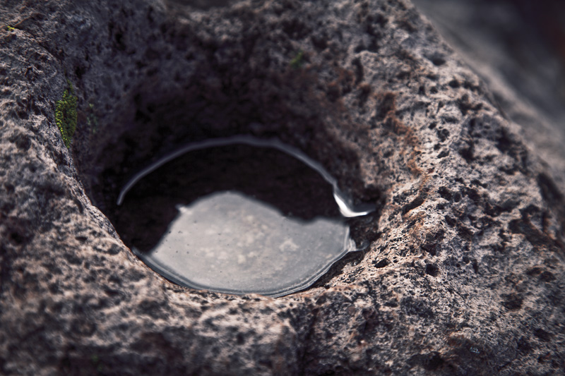 A grinding hole filled with water.