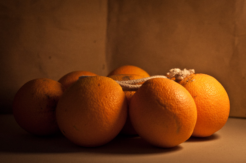 Oranges and a coil of rope.