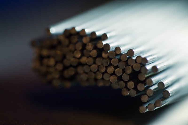 A macro photograph of the end of a bundle of pin flags.
