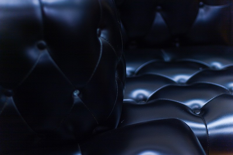 A shiny leather seat from an old car.