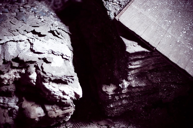 Stacks of paper falling apart due to long-term water damage.