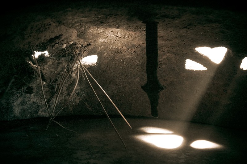 Light streaming through the windows of an ancient-looking room.