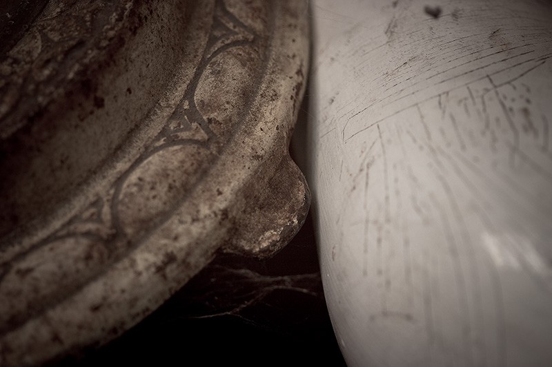 The base of a lamp and a ship's vent.