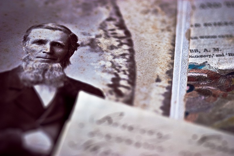 A photograph of a man with an Amish-style beard, and assorted other documents.