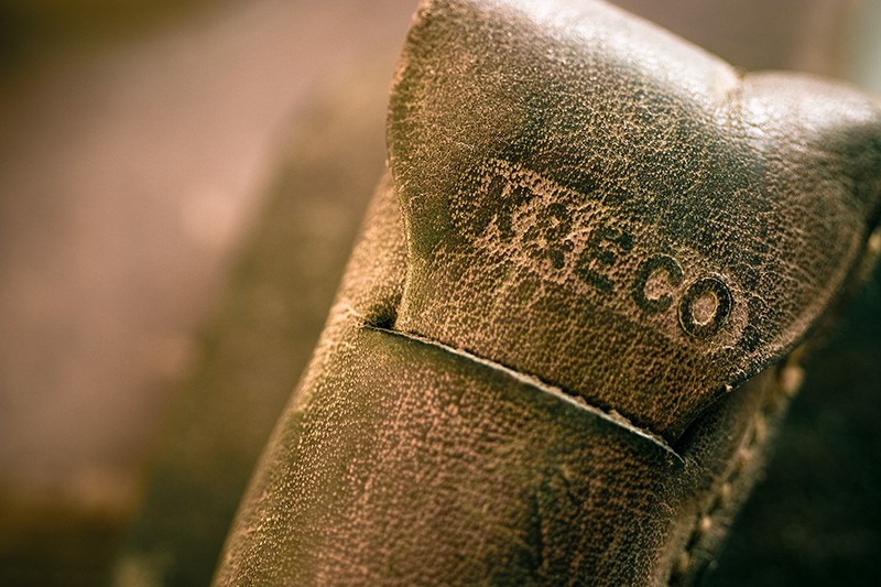 A leather tool case, with the letters "K&E CO".