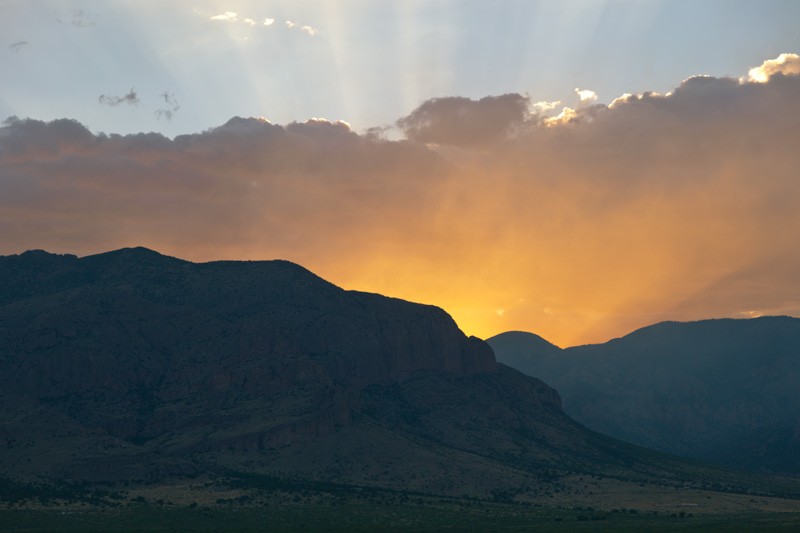 A sunset with rays of light splayed out.