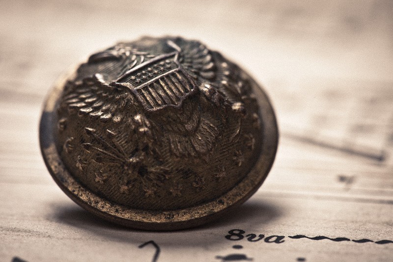 A detailed macro shot of an old military button.