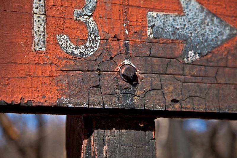 A burned Forest Service sign at Onion Saddle in the Chiricahua Mountains.