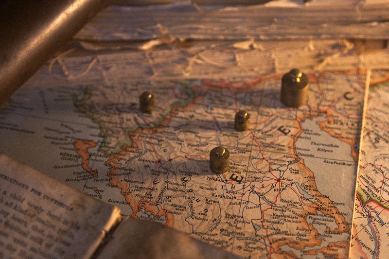 Markers laid out on a map, plotting positions.