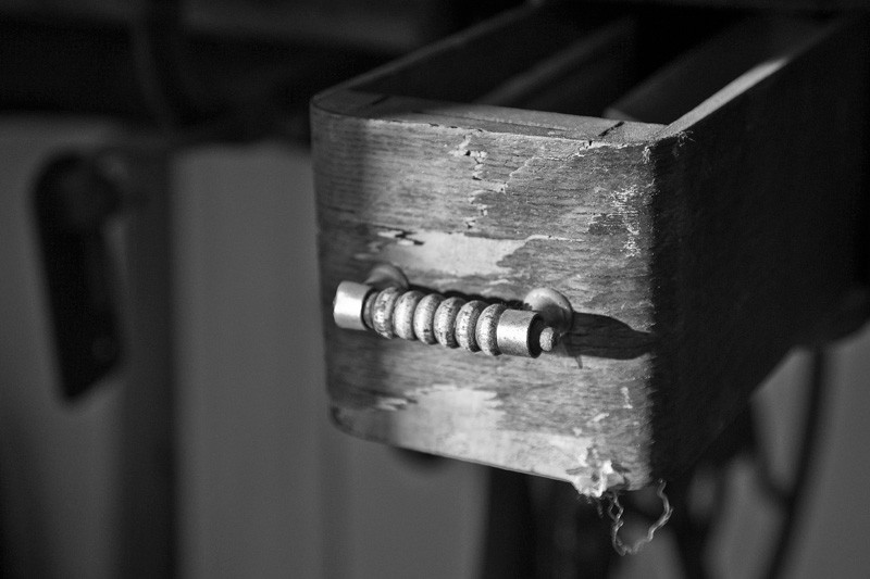 An old, weathered wooden drawer.