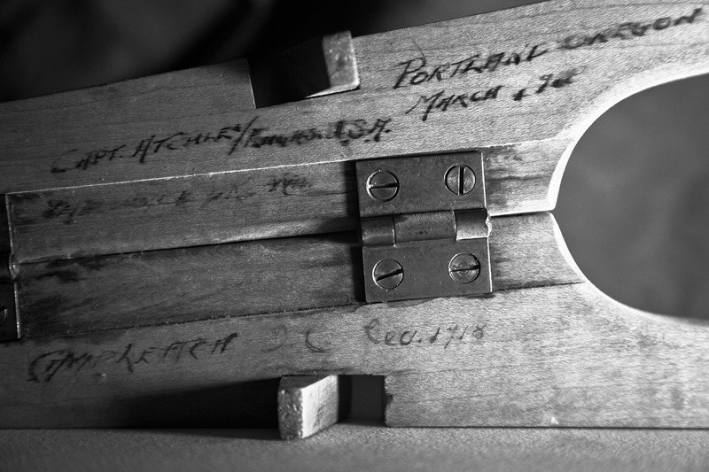 An inscribed boot remover.