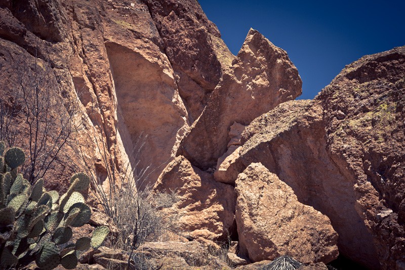 A wedge of rock fallen away from a cliff face.