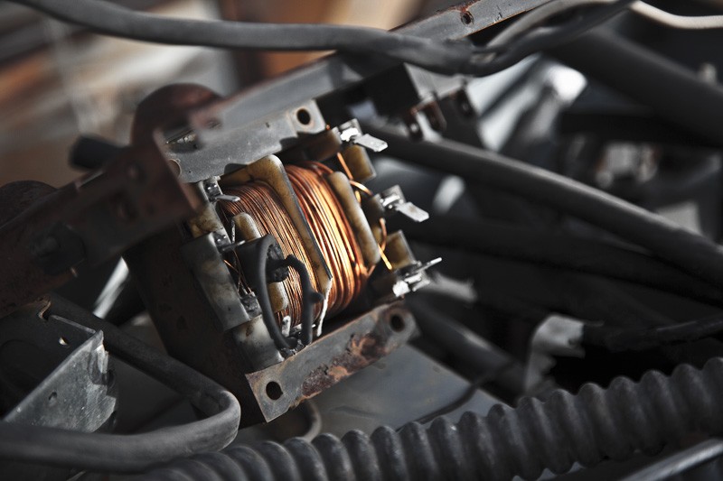 Two sections of wound copper wire with a division between.