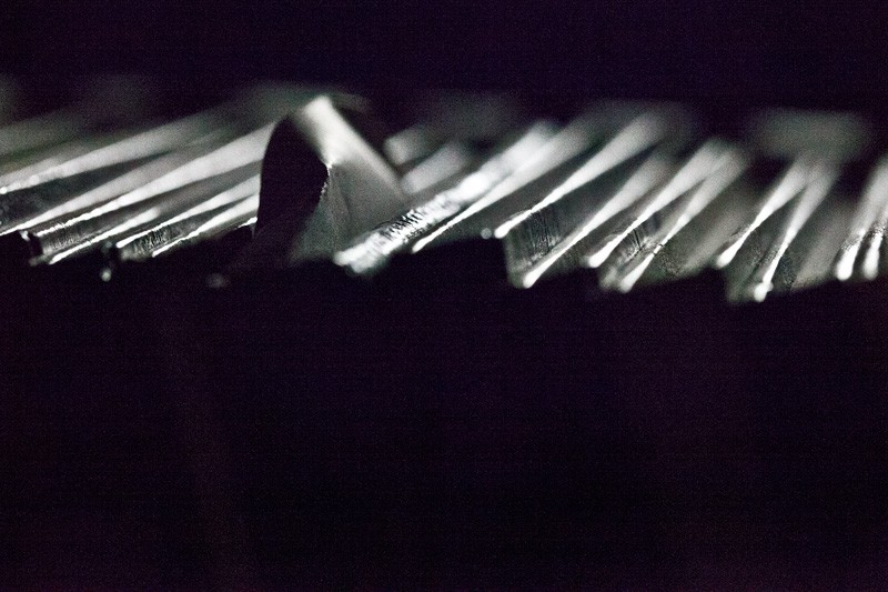 A piece of paper protruding from between books.