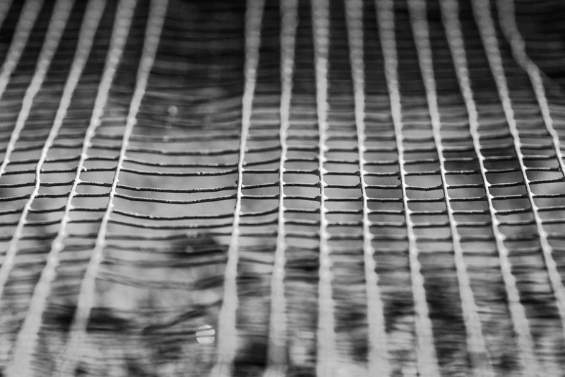 A sifter made of wire mesh, with some strands of wire missing.