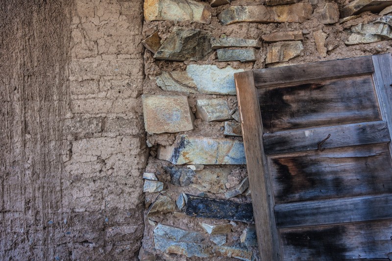 An adobe wall, and a stone wall, from an abandoned cabin in Happy Camp Canyon in the Dos Cabezas Wilderness.