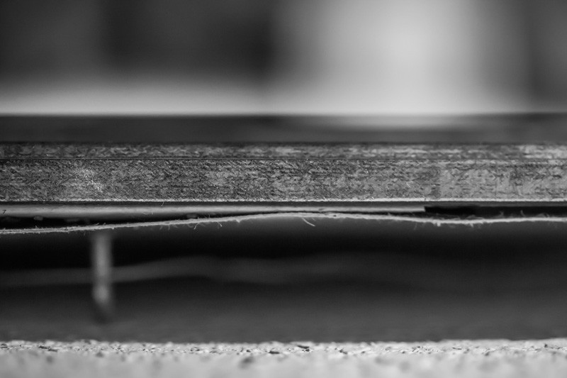 The back side of a framed piece of art.