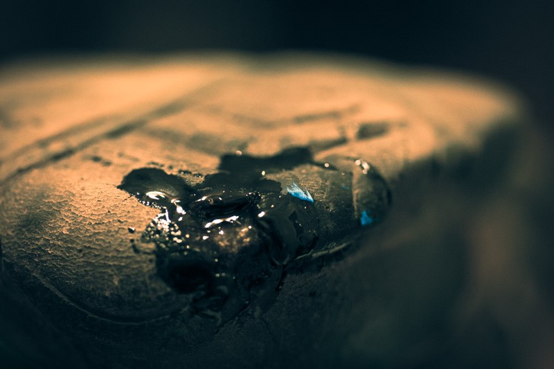 Glue drying on a shoe, with part of a rubber band stuck to it.