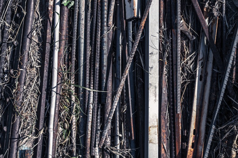A bunch of rebar on the ground.